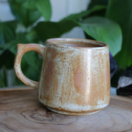 Handmade ceramic brown and cream hug mug with brush glaze, artisan tea cup