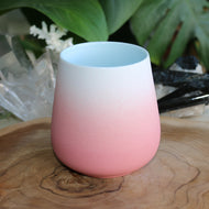 Handmade ceramic hug mug style with pink and white ombre glaze and blue centre
