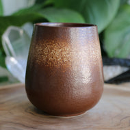 Handmade ceramic mug with brown and cream ombre glaze, handleless.