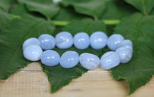 Load image into Gallery viewer, Handmade Blue Lace Agate crystal bracelet featuring natural blue and white banded nugget gemstone beads on elastic stretch cord.