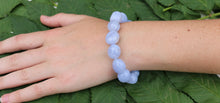 Load image into Gallery viewer, Handmade Blue Lace Agate crystal bracelet on wrist of size reference
