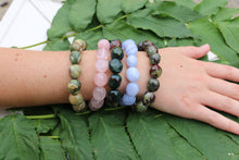 Load image into Gallery viewer, Blue Lace Agate stretch bracelet with other varieties of nugget bracelets on a person's wrist