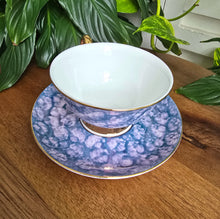 Load image into Gallery viewer, Purple tea cup with gold handle, gold rim and matching saucer